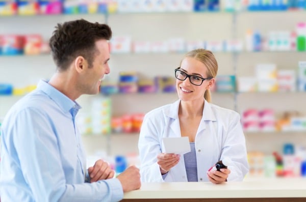 pharmacist helping customer